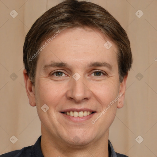 Joyful white adult male with short  brown hair and brown eyes