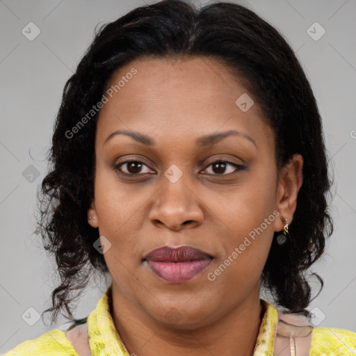 Joyful latino adult female with medium  brown hair and brown eyes