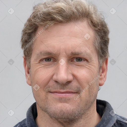 Joyful white adult male with short  brown hair and grey eyes