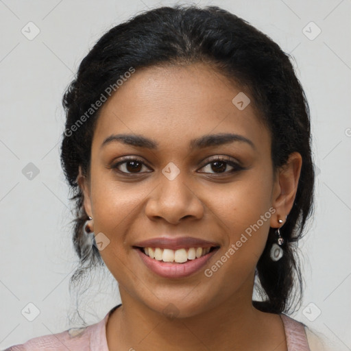 Joyful latino young-adult female with long  black hair and brown eyes