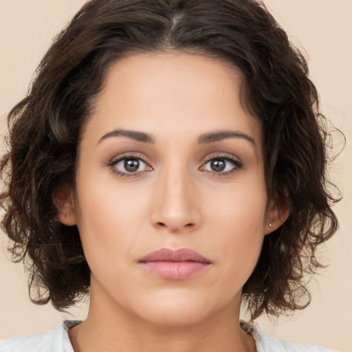 Neutral white young-adult female with medium  brown hair and brown eyes