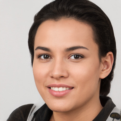 Joyful white young-adult female with medium  brown hair and brown eyes