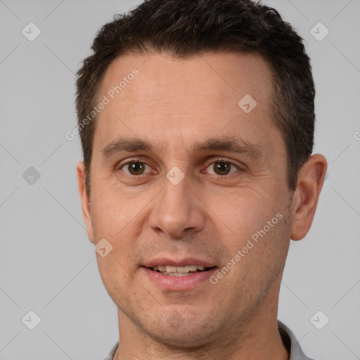 Joyful white adult male with short  brown hair and brown eyes