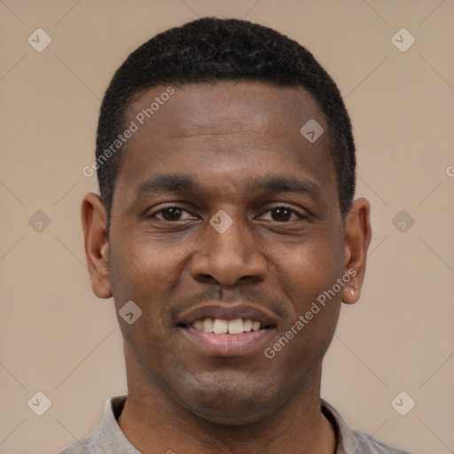 Joyful black young-adult male with short  black hair and brown eyes