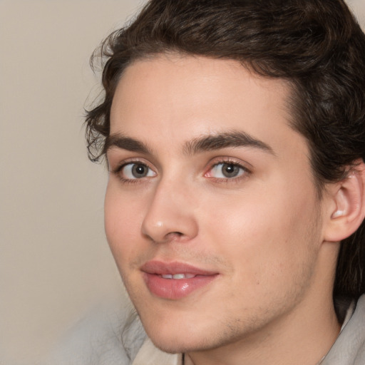 Joyful white young-adult male with medium  brown hair and brown eyes