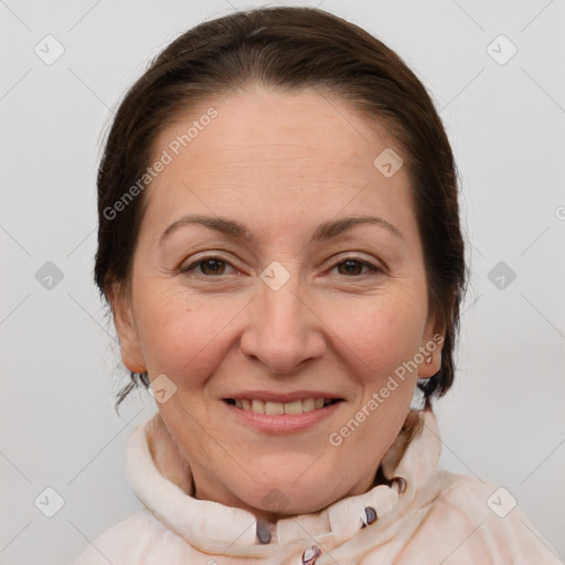 Joyful white adult female with medium  brown hair and brown eyes