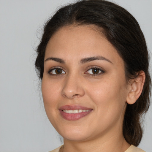 Joyful white young-adult female with medium  brown hair and brown eyes