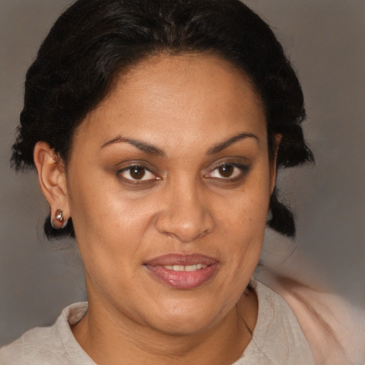 Joyful black adult female with short  brown hair and brown eyes