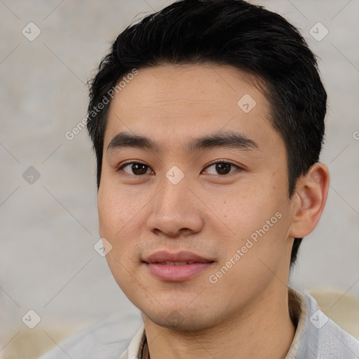 Joyful white young-adult male with short  black hair and brown eyes