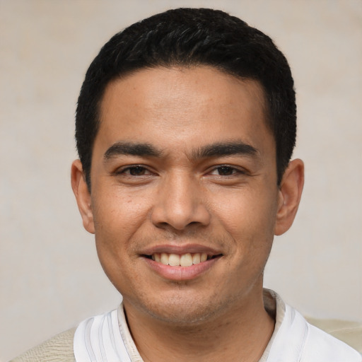 Joyful asian young-adult male with short  black hair and brown eyes