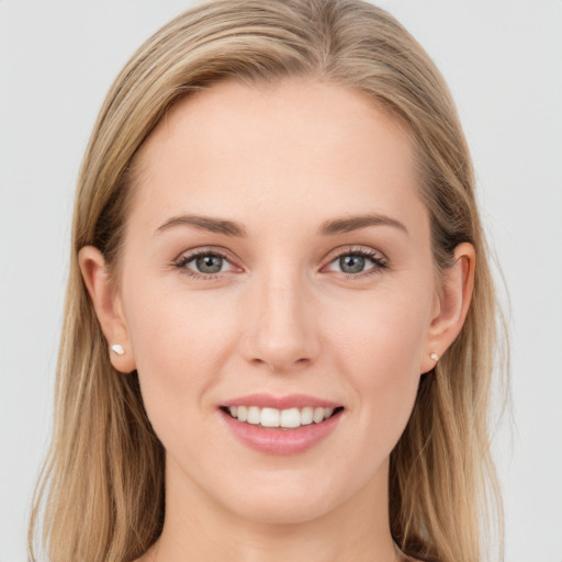 Joyful white young-adult female with long  brown hair and grey eyes