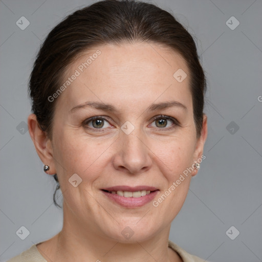 Joyful white adult female with medium  brown hair and grey eyes