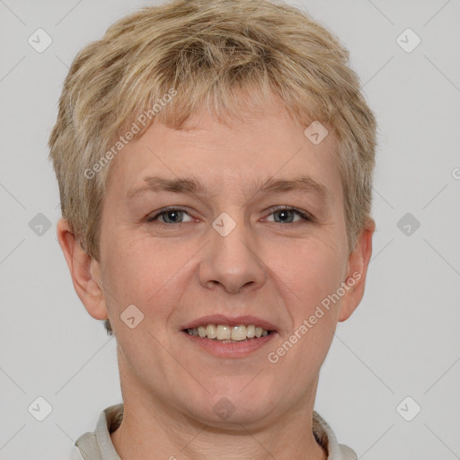 Joyful white adult male with short  brown hair and grey eyes