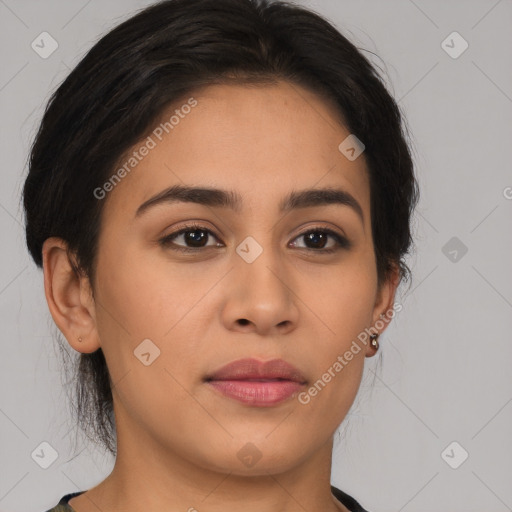 Joyful latino young-adult female with medium  brown hair and brown eyes