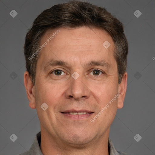 Joyful white adult male with short  brown hair and brown eyes