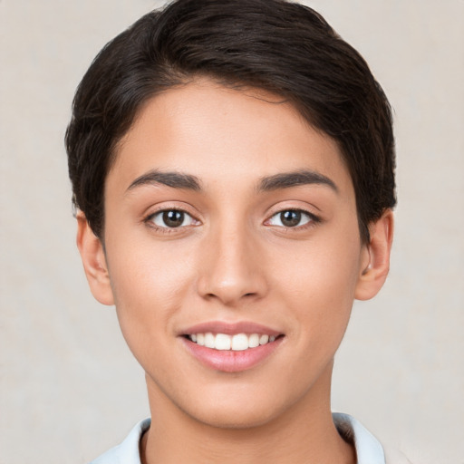 Joyful white young-adult female with short  brown hair and brown eyes