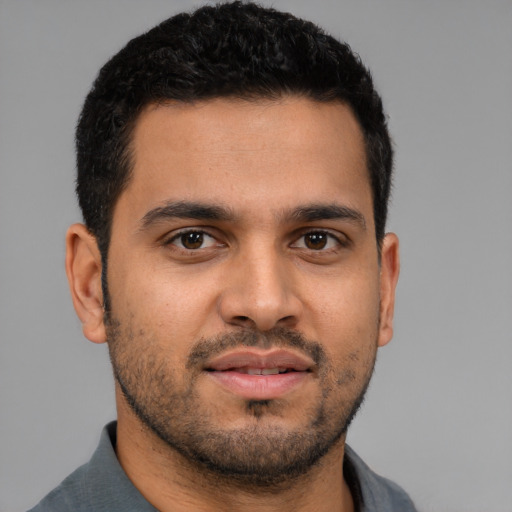 Neutral latino young-adult male with short  brown hair and brown eyes
