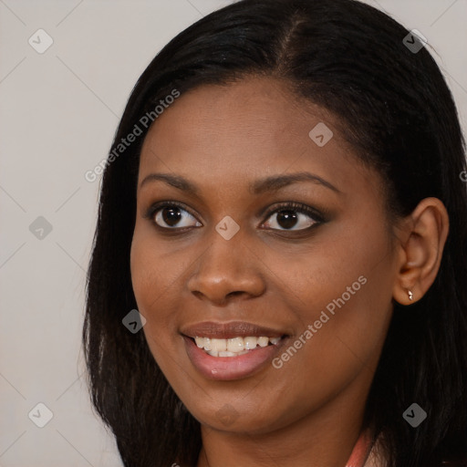 Joyful black young-adult female with long  brown hair and brown eyes