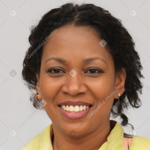 Joyful latino adult female with medium  brown hair and brown eyes
