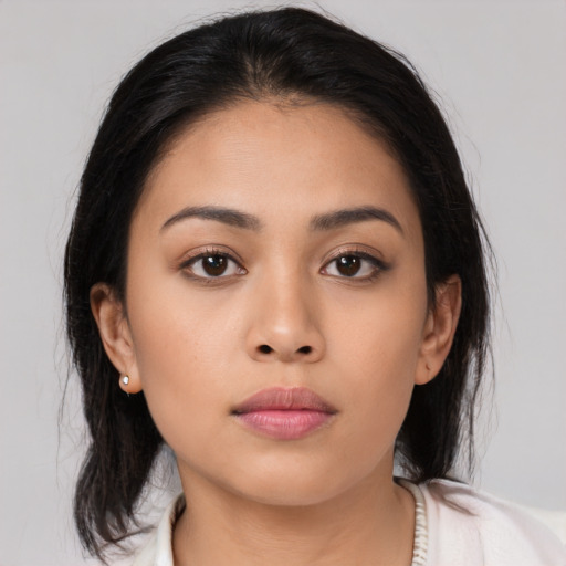Neutral asian young-adult female with medium  brown hair and brown eyes