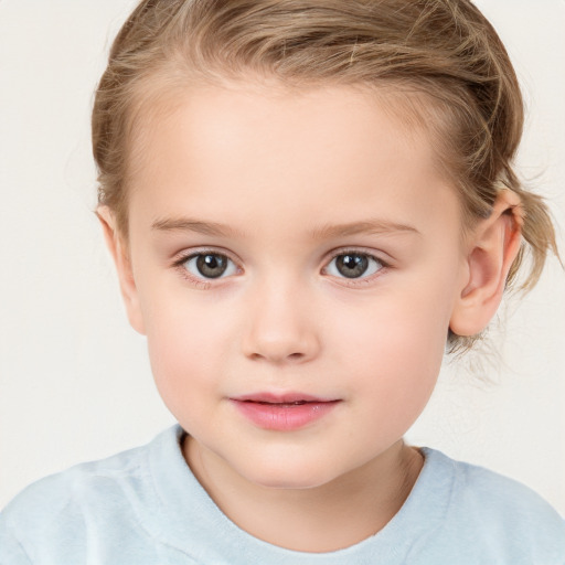 Joyful white child female with medium  brown hair and grey eyes