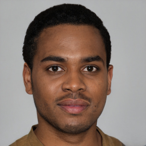 Joyful latino young-adult male with short  brown hair and brown eyes