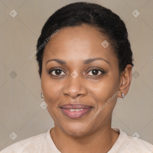 Joyful black adult female with short  black hair and brown eyes