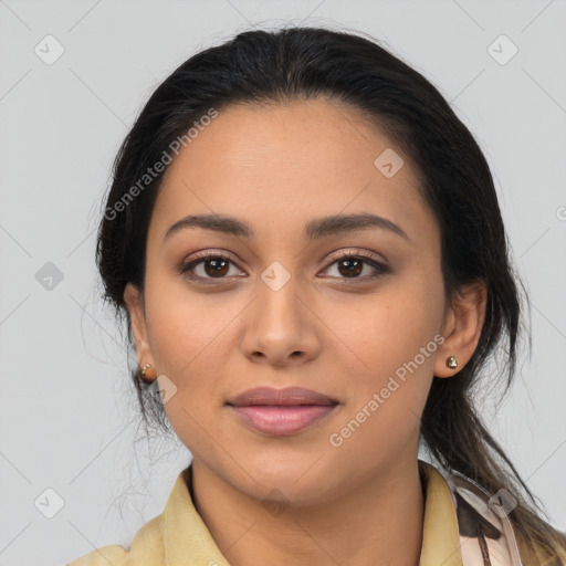 Joyful latino young-adult female with long  black hair and brown eyes