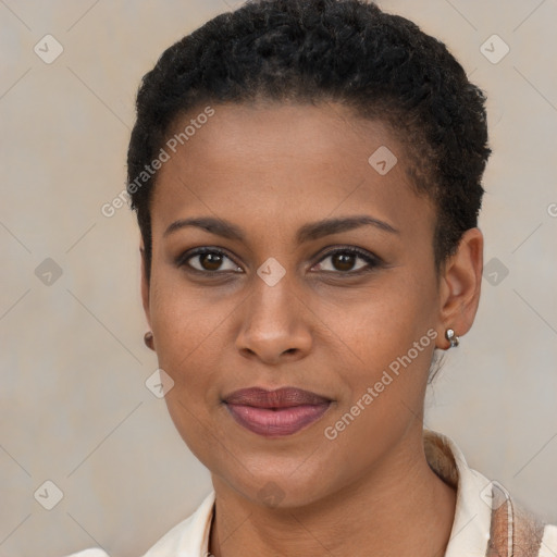 Joyful black young-adult female with short  brown hair and brown eyes