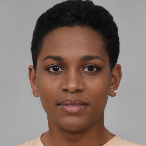 Joyful black young-adult female with short  black hair and brown eyes