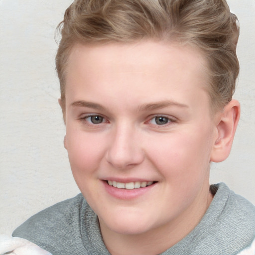 Joyful white young-adult female with short  brown hair and blue eyes