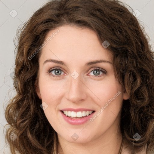 Joyful white young-adult female with long  brown hair and green eyes