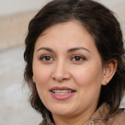 Joyful white adult female with medium  brown hair and brown eyes