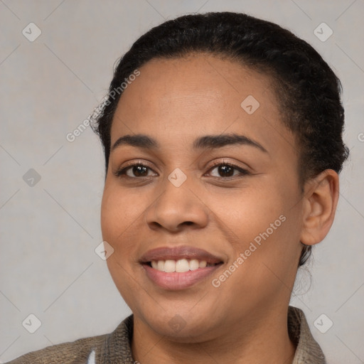 Joyful latino young-adult female with short  brown hair and brown eyes