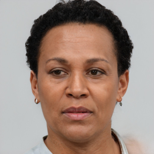Neutral latino adult female with short  brown hair and brown eyes