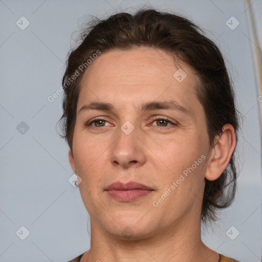 Joyful white adult female with short  brown hair and brown eyes