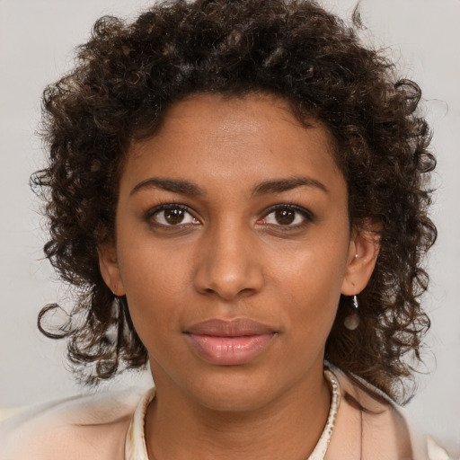 Neutral black young-adult female with medium  brown hair and brown eyes