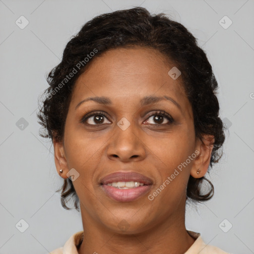 Joyful black adult female with short  brown hair and brown eyes