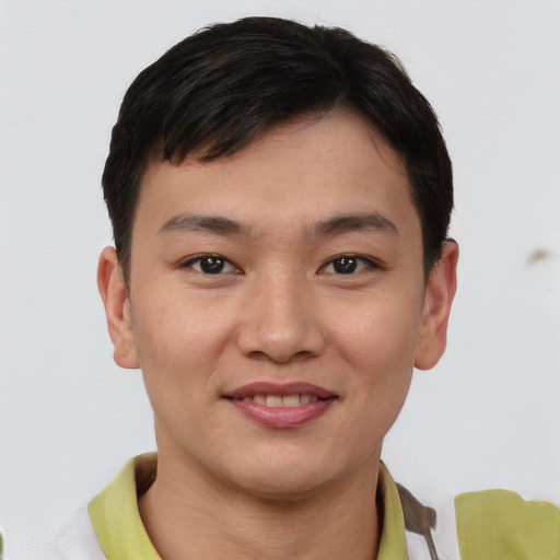 Joyful asian young-adult male with short  brown hair and brown eyes