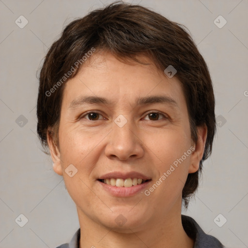 Joyful white adult female with medium  brown hair and brown eyes