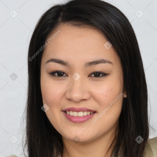 Joyful asian young-adult female with long  brown hair and brown eyes