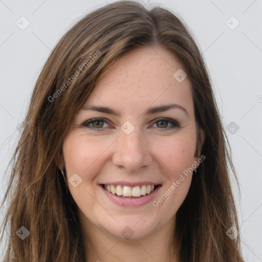 Joyful white young-adult female with long  brown hair and brown eyes