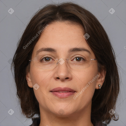 Joyful white adult female with medium  brown hair and brown eyes