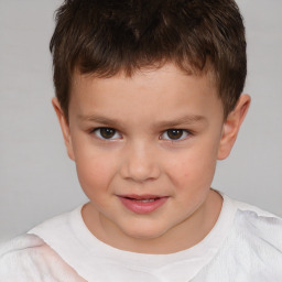 Joyful white child male with short  brown hair and brown eyes