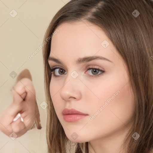 Neutral white young-adult female with long  brown hair and brown eyes