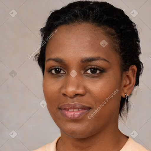 Joyful black young-adult female with medium  black hair and brown eyes