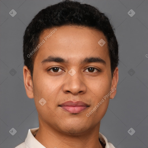 Joyful latino young-adult male with short  brown hair and brown eyes