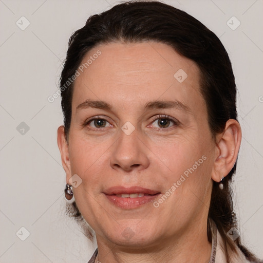 Joyful white adult female with short  brown hair and brown eyes