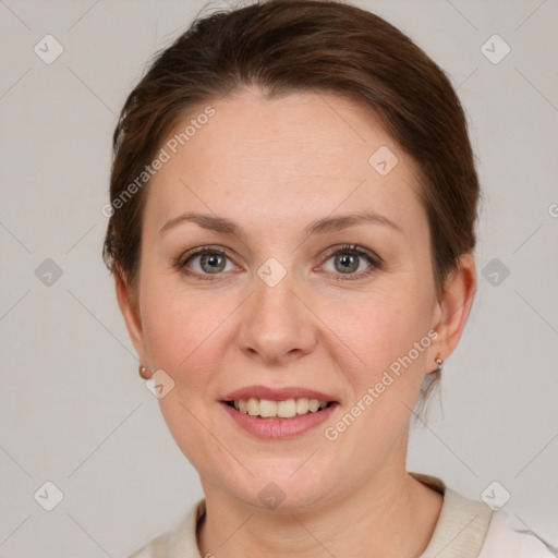 Joyful white adult female with short  brown hair and grey eyes