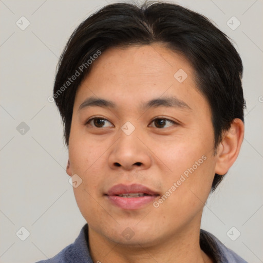 Joyful asian young-adult male with short  brown hair and brown eyes